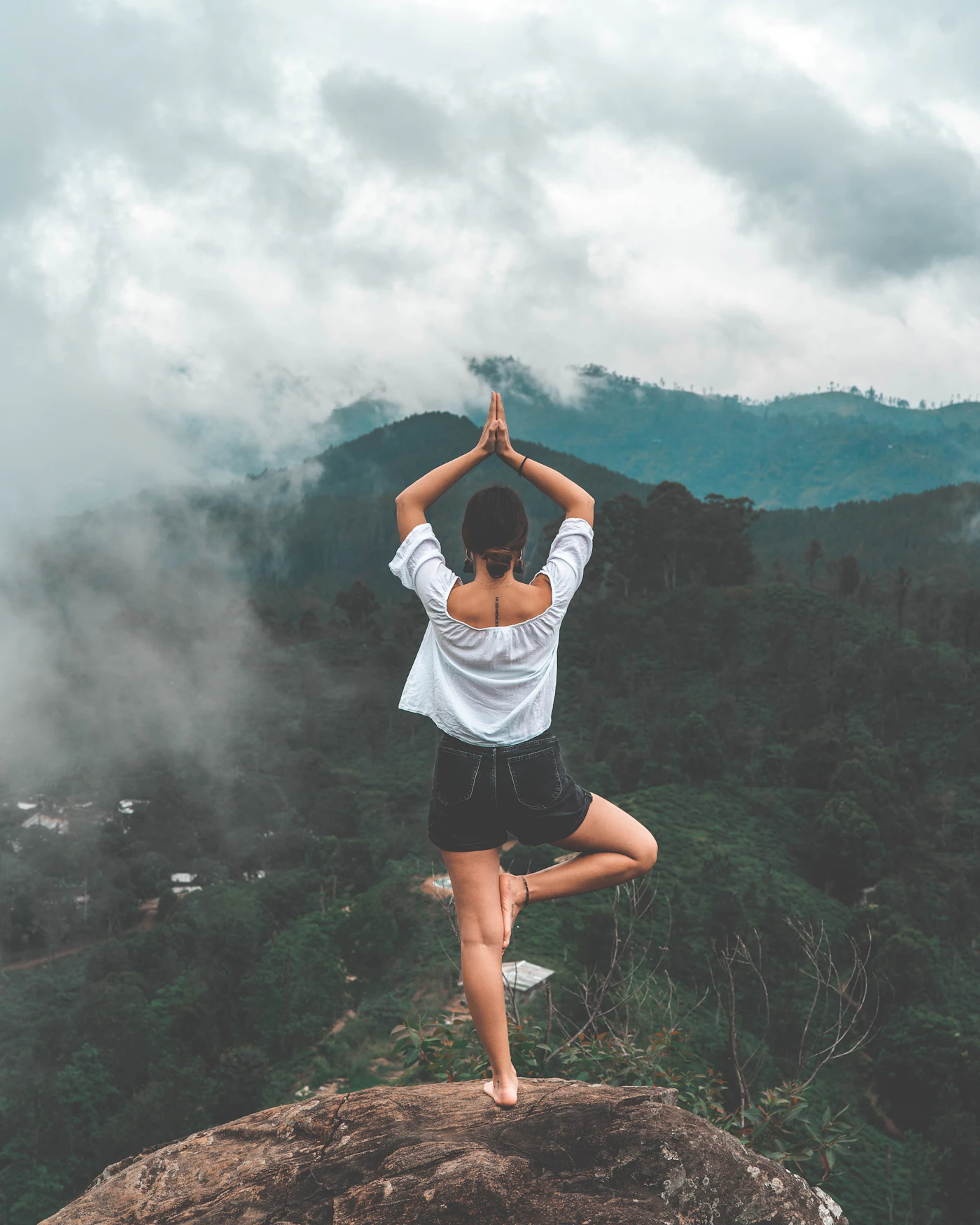 Calm view of a person practising mindful breathing by a window